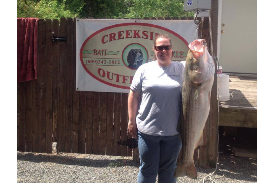 Lisa Dealy with another nice 37 lb striper!