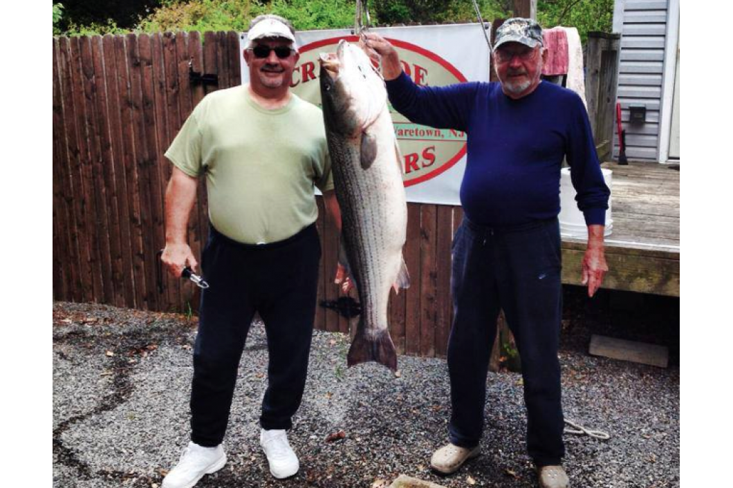 Larry Rasica with his Striper of 44.2lbs off bathing beach in the Ocean on Bunker Spoons
